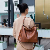 Helle™ | Anti-tyveri Lædertaske i hobo-stil + GRATIS pung